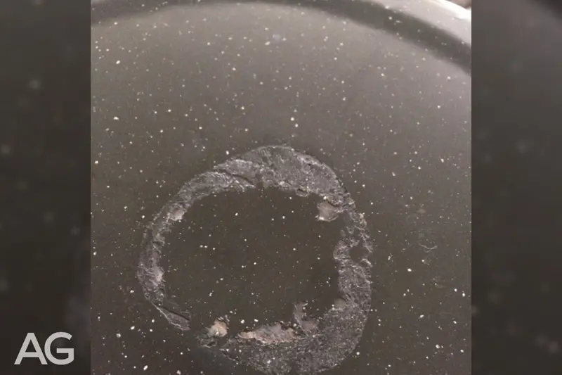 Glass cooktop damaged when a stuck pot is pulled from the surface