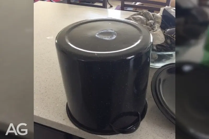 Damaged cookware base that is unsafe for a smooth glass cooktop