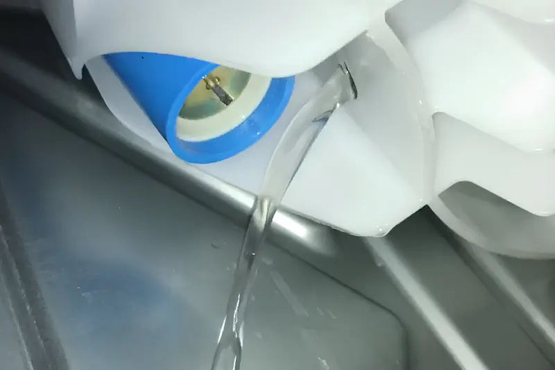 GE washer leaking water from internal component