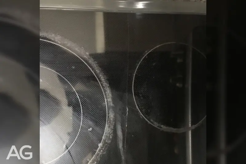 Single heat-related crack running across a glass cooktop