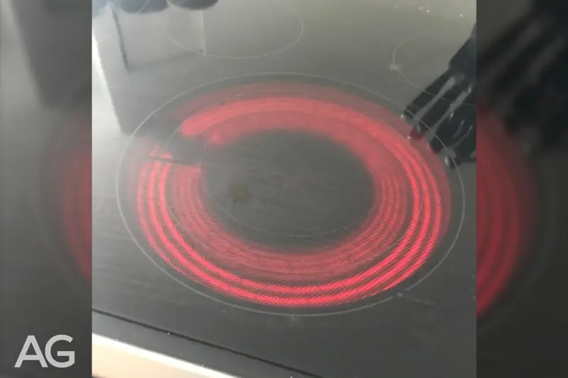 Inoperable range heating coil causing uneven heating beneath a glass cooktop