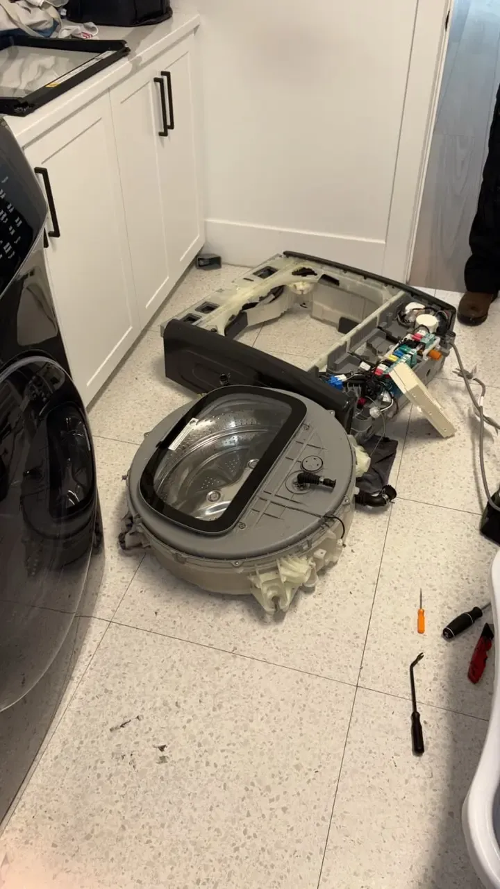 Samsung FlexWash upper washer tub and lid assembly removed from the cabinet during lid replacement