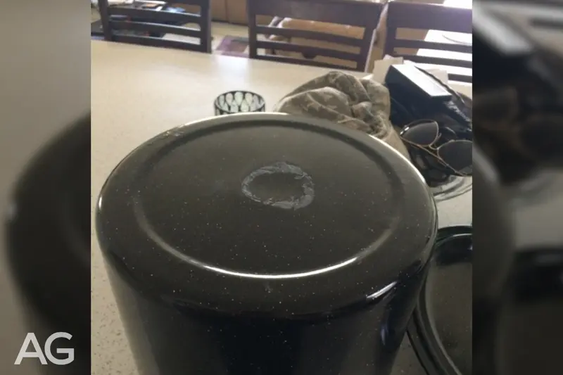Uneven-bottom pot that contributed to damage on a glass cooktop