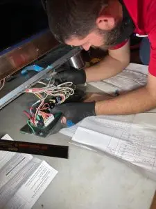 Technician Repairing GE Oven Relay Board